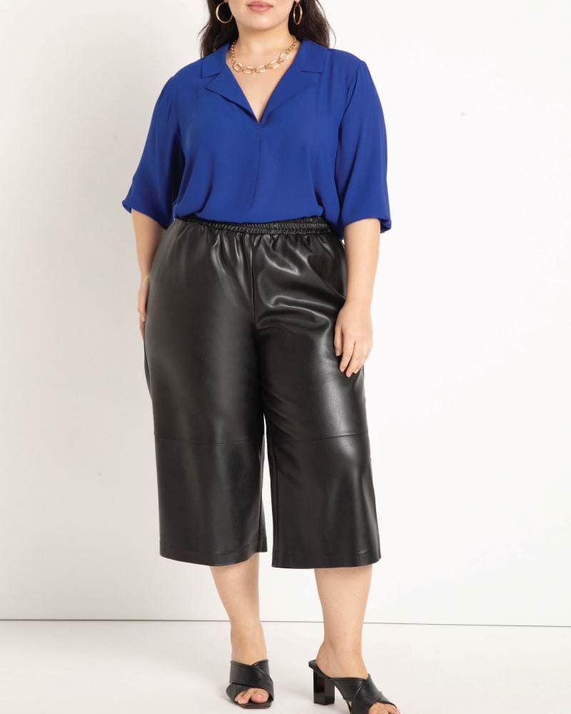 Front of a model wearing a size 14 Oaklyn Deep V Collar Top in Cobalt by ELOQUII. | dia_product_style_image_id:196143